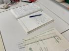 Lab books documenting different features of the plant samples in the storage room