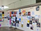 Dozens of flyers hang inside the main entrance to ENS Lyon.