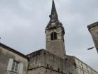 A clock tower looms over La Rochelle near the main park