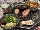 Samgyeopsal is cooked on a grill built into the table... can you find the smoke pipe?