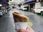 Hotteok, a sweet pancake with a brown sugar filling