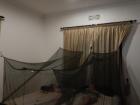 Mosquito nets in our Tanzanian bedroom. In Rwanda, I use electric plug-ins