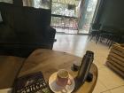 Reading my new book at one of my favorite coffee shops