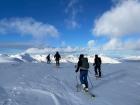 My friends and I skiing up a mountain