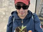 Holding a Frailejon sapling to plant in the hike we were going