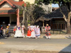 Elementary school students dressing up in traditional clothes for a parade