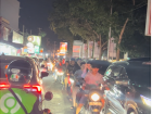 Gojek drivers wear green Gojek jackets