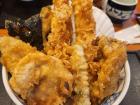 Fried vegetables, shrimp, mushrooms and more on a bowl of rice