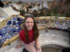 I posed by the mosaic-tiled benches in Parque Guell in Barcelona