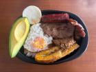 Another "bandeja paisa," a heavy meal that usually has rice, beans, "morcilla" (blood sausage), a slice of avocado, plantain, "chicharrones" (fried pork belly) or beef, an "arepa" and a fried egg