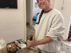 My local friend helping me mix the cake batter