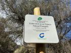 A sign reminding visitors that they should respect the land