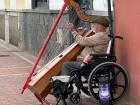 An old man playing the harp