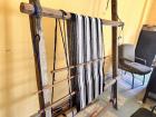 Warps on the three sticks that create the layers of the cloth before Ochi-aya is attached.