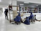 Women weaving during the Female Artists Association of Nigeria's (FEAAN) International Women's Day Exhibition at Nike Art Gallery.