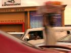 Vendors use the traffic to their advantage and sell goods while cars wait at red lights.