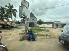 A woman with a disability waits for a passersby to offer assistance. One woman gave her some money soon after this picture was taken.