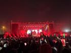 Fans eagerly film Rema's homecoming concert.