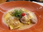 Pan fried Maultaschen served in a cheese sauce with freshly shaved truffles - a seasonal option at a local Schwaben restaurant in Tübingen