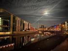 A night-time view of the river Spree, which bisects the city - parts of the wall were along the water on the left side of this image