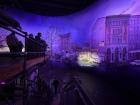 An indoor panorama that depicts the Berlin Wall from the point of view of someone standing on a platform in West Berlin
