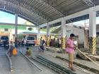 Construction workers build food stands out of bamboo