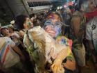 Covered in paint at Sinulo; a stranger was carrying around two large iguanas, so I got to hold one!