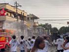 Firefighters spray water at parade goers in San Jose