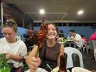 Enjoying chicken inasal and barbeque at a carinderia, or food stand