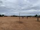 Typical Malawian football pitch considering of a lot of bumps, divots, and dirt!