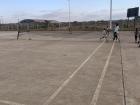 The makeshift court at least has painted lines, but we do get a lot of people walking through the area coming to and from the stadium!