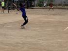 Brian hitting a serve against Tony in a match