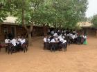 When there is not enough space in the classrooms, students work in the courtyard