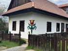 Embroidery shop in Hollókő, with the most popular Hungarian tulip embroidery design on the outside of the building