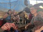 Weekly markets are a chance to socialize and catch up with friends