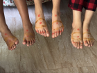 During Kanu Pongal, everyone's feet are coated in turmeric and kumkum