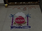 Kolam is a traditional South Indian art form that involves drawing geometric patterns on the floor using rice flour