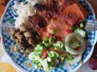Fried trout, rice, beans and a salad, a meal commonly served in my host family's home