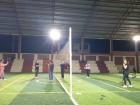 Playing volleyball in the covered sports complex in town