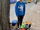 Buying peaches and strawberries from my friendly fruit vendor.