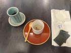 A cup of tea and sour-tasting custard