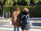 It's common for people of all ages, from children to the elderly, to walk arm-in-arm with their friends.