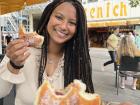 Enjoying a Berliner donut in Köln, Germany when I was on a fellowship from 2021-2022