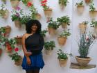 Potted flowers on the wall is a unique look here in Spain
