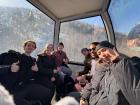 In the mountains, people are transported in these closed-door cable cars!