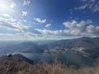 Beautiful blue skies, lake, and mountains in Como.