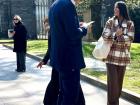 A graduate outside the school! (oops I caught him on his phone!)