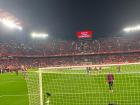 This is a picture of a Sevilla FC game with the players in action. 