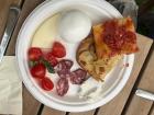 Sampling the cheeses, tomatoes and pizza