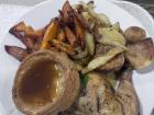 Roast chicken, crispy potatoes, glazed sweet potatoes and Yorkshire pudding filled with rich gravy: the ultimate comfort meal!